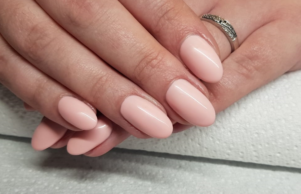 Glossy nude almond-shaped nails
